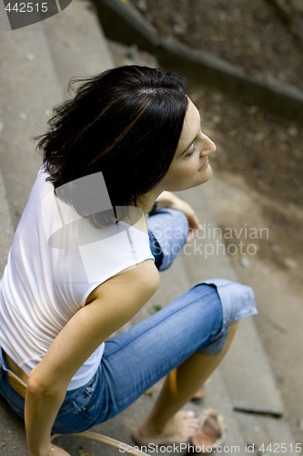 Image of woman sitting on a staircase