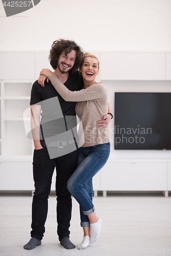 Image of couple hugging in their new home