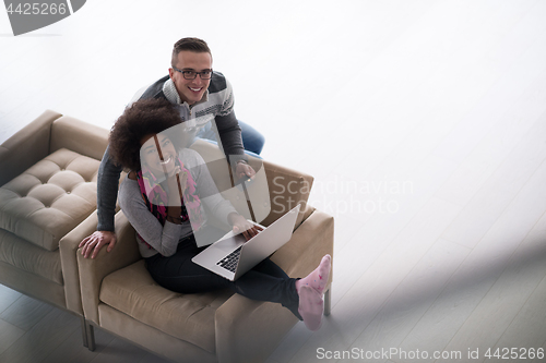 Image of multiethnic couple shopping online