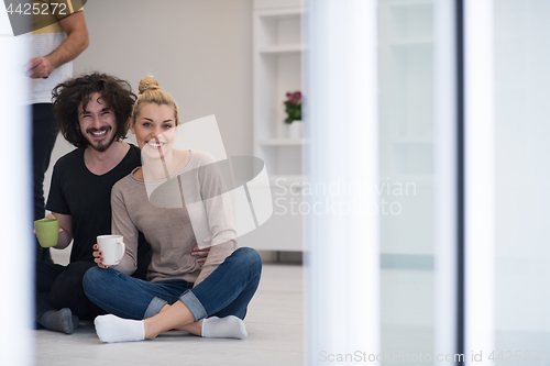 Image of young couple in their new home