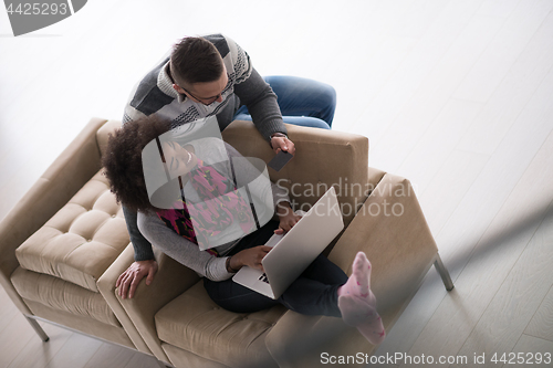 Image of multiethnic couple shopping online