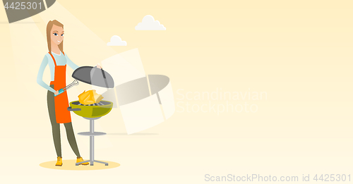 Image of Woman cooking chicken on barbecue grill.
