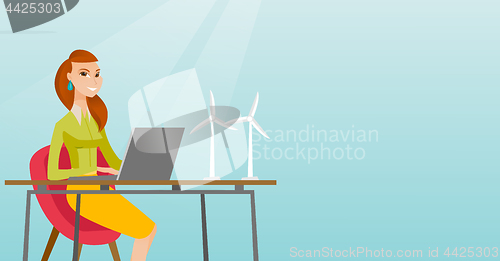 Image of Woman working with model of wind turbines.