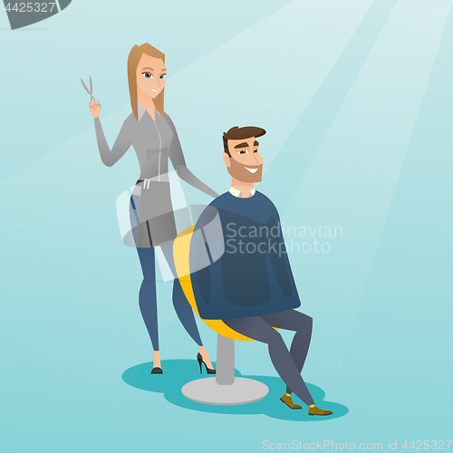 Image of Hairdresser making haircut to hipster man.
