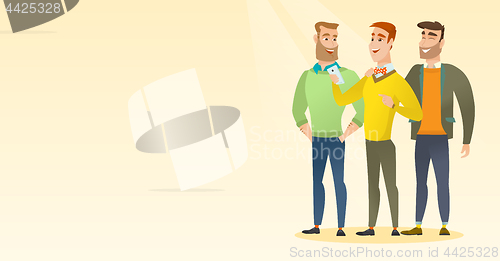 Image of Three smiling friends looking at mobile phone.
