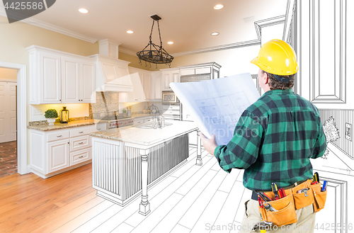 Image of Male Contractor with Hard Hat and Plans Looking At Custom Kitche