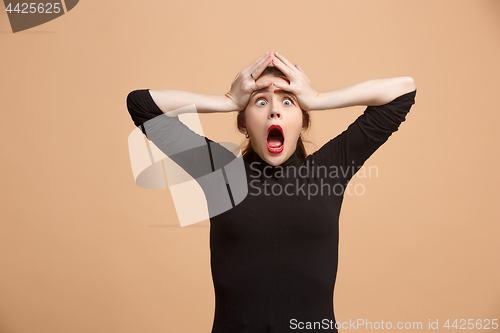 Image of Beautiful woman in stress isolated on pastel
