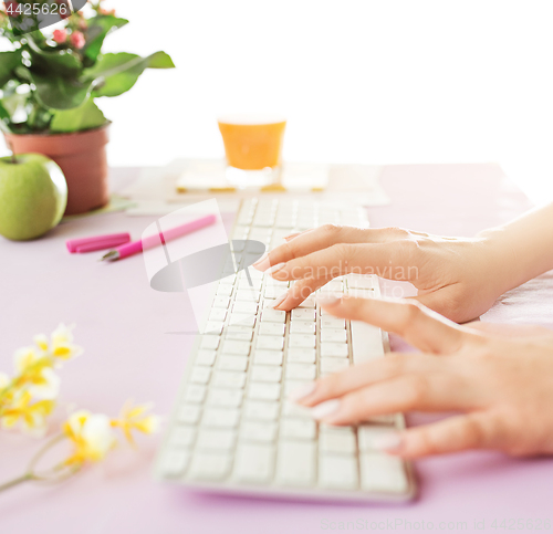 Image of Woman and fruit diet while working on computer in office