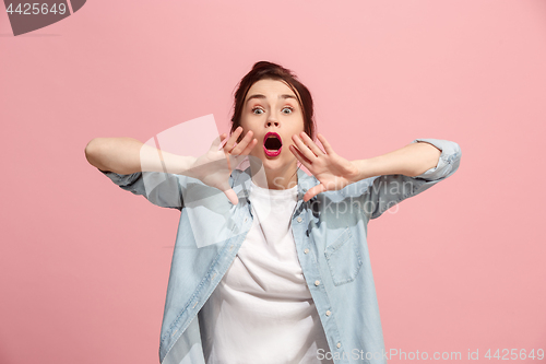 Image of Isolated on pink young casual woman shouting at studio