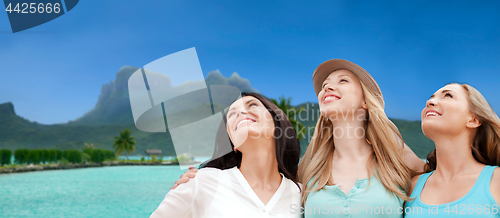 Image of happy women over bora bora background