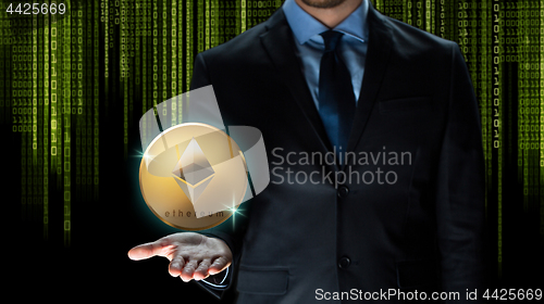 Image of businessman with ethereum coin over binary code