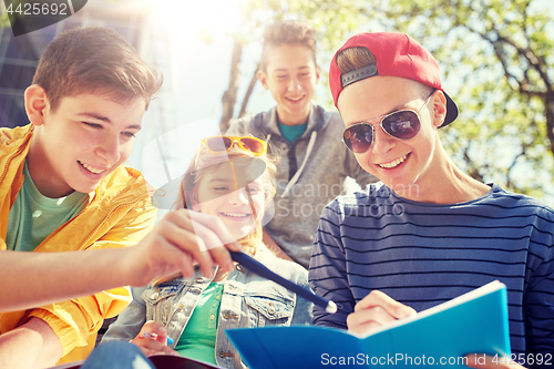 Image of group of students with notebooks at school yard