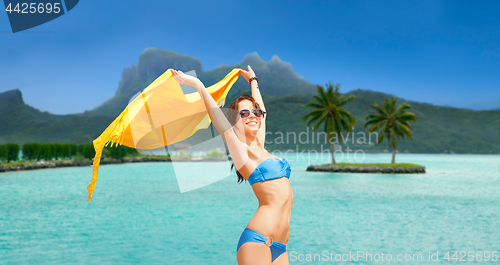 Image of woman in bikini and sunglasses on bora bora beach