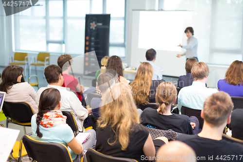 Image of Speaker giving presentation on business conference.