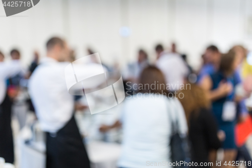 Image of Blured image of businesspeople at coffee break at conference meeting.