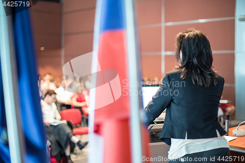 Image of Public speaker giving talk at Business Event.