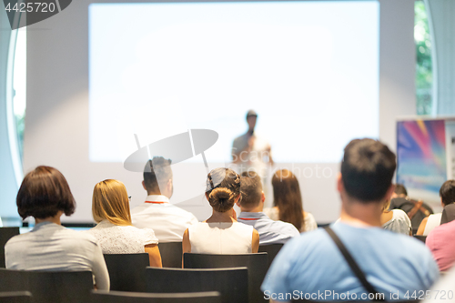 Image of Business speaker giving a talk at business conference event.