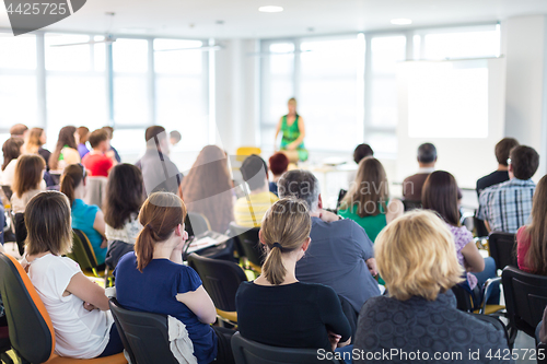 Image of Speaker giving presentation on business conference.