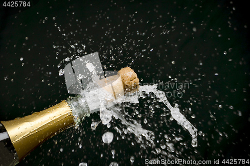 Image of a champagne cork is popping out