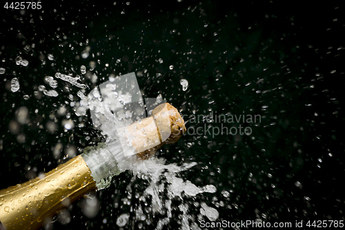 Image of a champagne cork is popping out