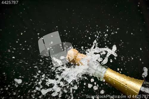 Image of a champagne cork is popping out