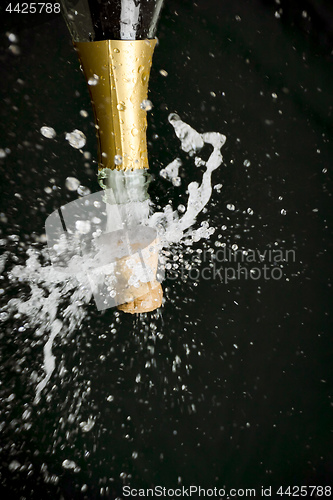 Image of a champagne cork is popping out