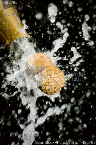 Image of a champagne cork is popping out