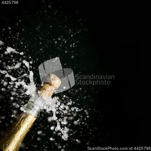 Image of a champagne cork is popping out