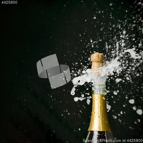 Image of a champagne cork is popping out