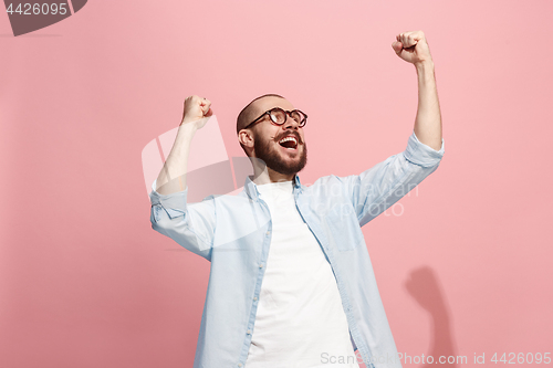 Image of Winning success man happy ecstatic celebrating being a winner. Dynamic energetic image of male model