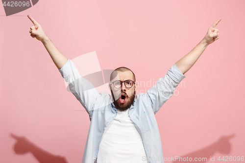 Image of Winning success man happy ecstatic celebrating being a winner. Dynamic energetic image of male model