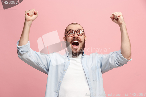 Image of Winning success man happy ecstatic celebrating being a winner. Dynamic energetic image of male model