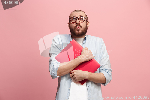 Image of Businessman hugging laptop