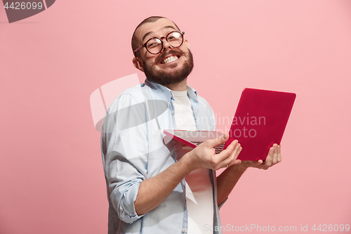 Image of Businessman hugging laptop