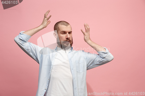 Image of Beautiful man in stress isolated on pink