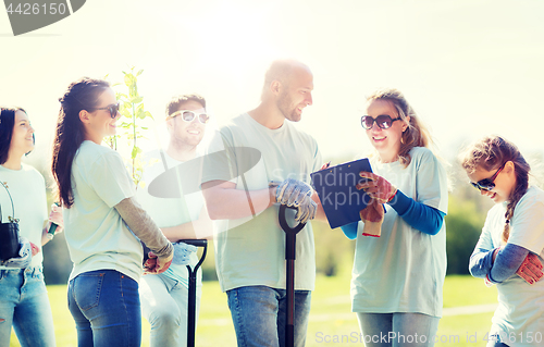 Image of group of volunteers planting trees in park