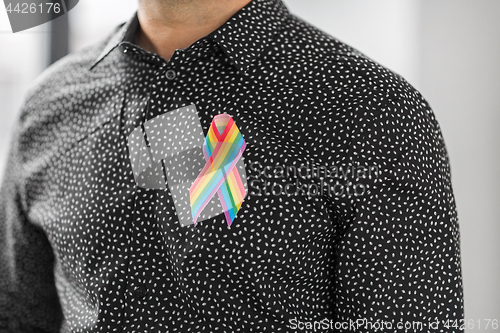 Image of man with gay pride rainbow awareness ribbon