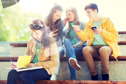 Image of student girl suffering of classmates mockery