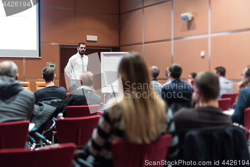 Image of Skiled Public Speaker Giving a Talk at Business Meeting.