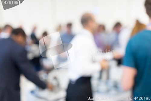 Image of Blured image of businesspeople at coffee break at conference meeting.