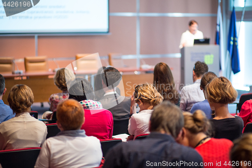 Image of Business speaker giving a talk at business conference event.