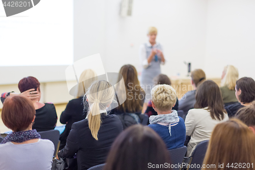 Image of Woman giving presentation on business conference.