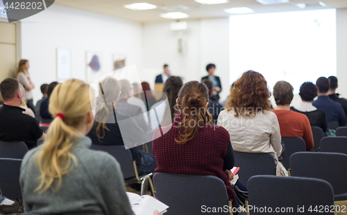 Image of Speaker giving presentation on business conference.