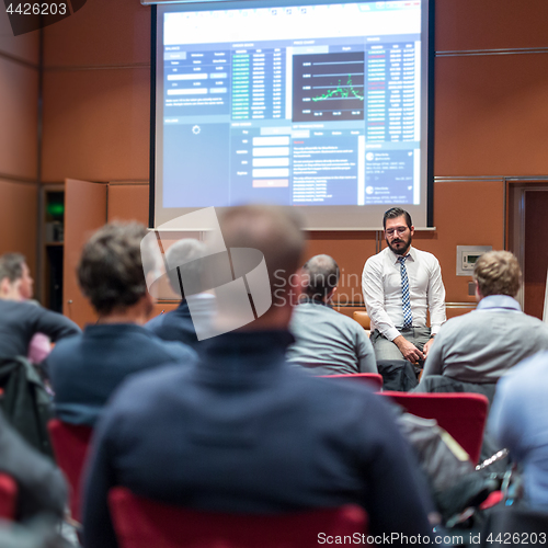 Image of Skiled Public Speaker Giving a Talk at Business Meeting.