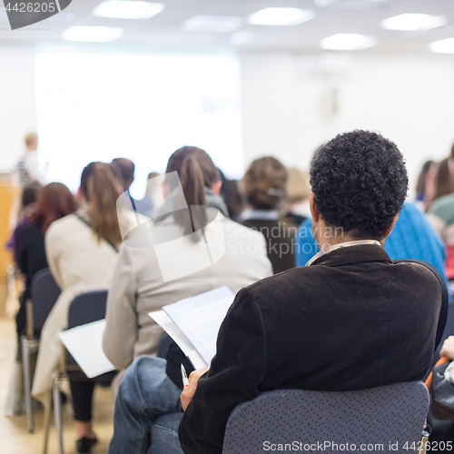 Image of Woman giving presentation on business conference.