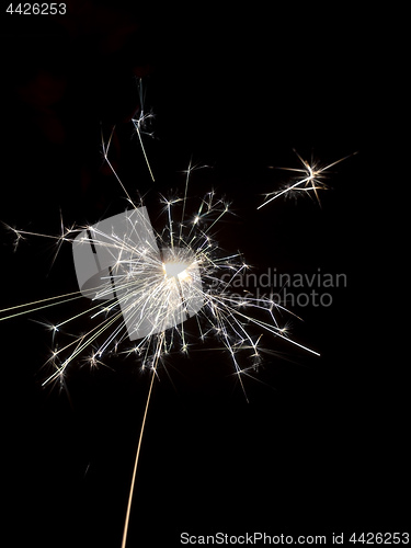 Image of typical sparkler with dark background