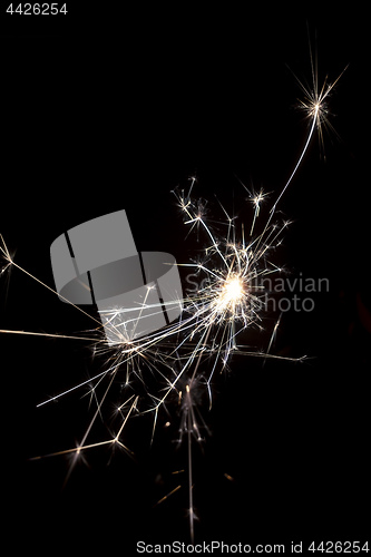 Image of typical sparkler with dark background