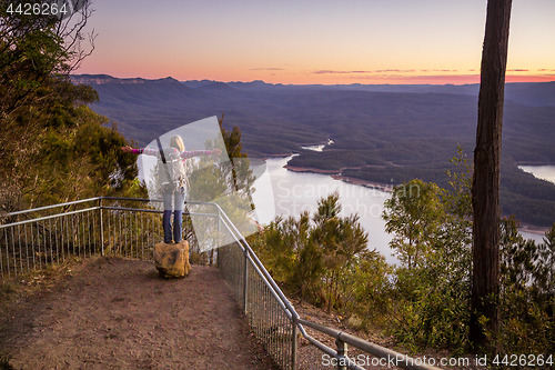 Image of Hiker enjoying the river valley views