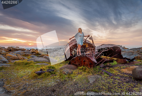 Image of Female exploring rusting shipwrecks along Australian coast