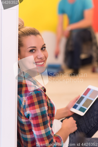 Image of couple doing home renovations